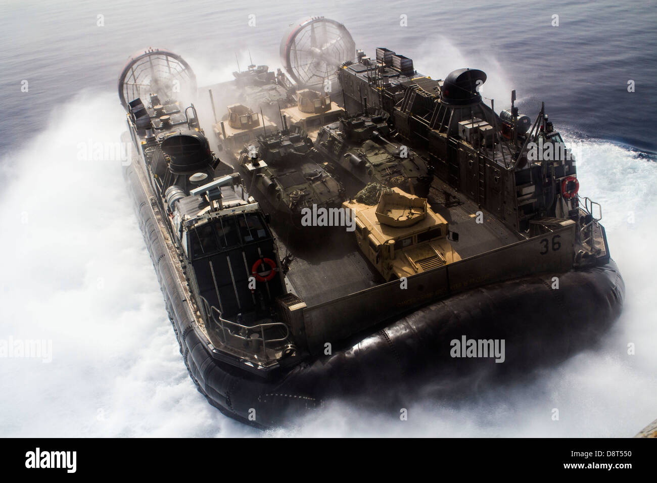 landing craft, air cushion vessel assigned to the amphibious assault ship USS Kearsarge (LHD 3) transports light armored vehicl Stock Photo