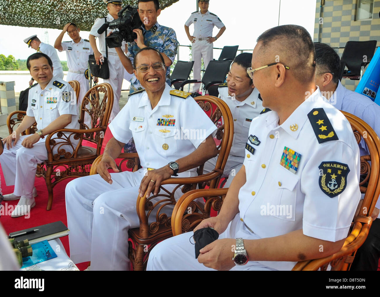 ZHANJIANG, China (May 31, 2013) Adm. Cecil Haney, commander of U.S. Pacific Fleet, left, and Vice Adm. Jiang Weilie, commander of People's Liberation Army (PLA) Navy's South Sea Fleet (SSF), share a light moment before a demonstration of the PLA SSF Marin Stock Photo