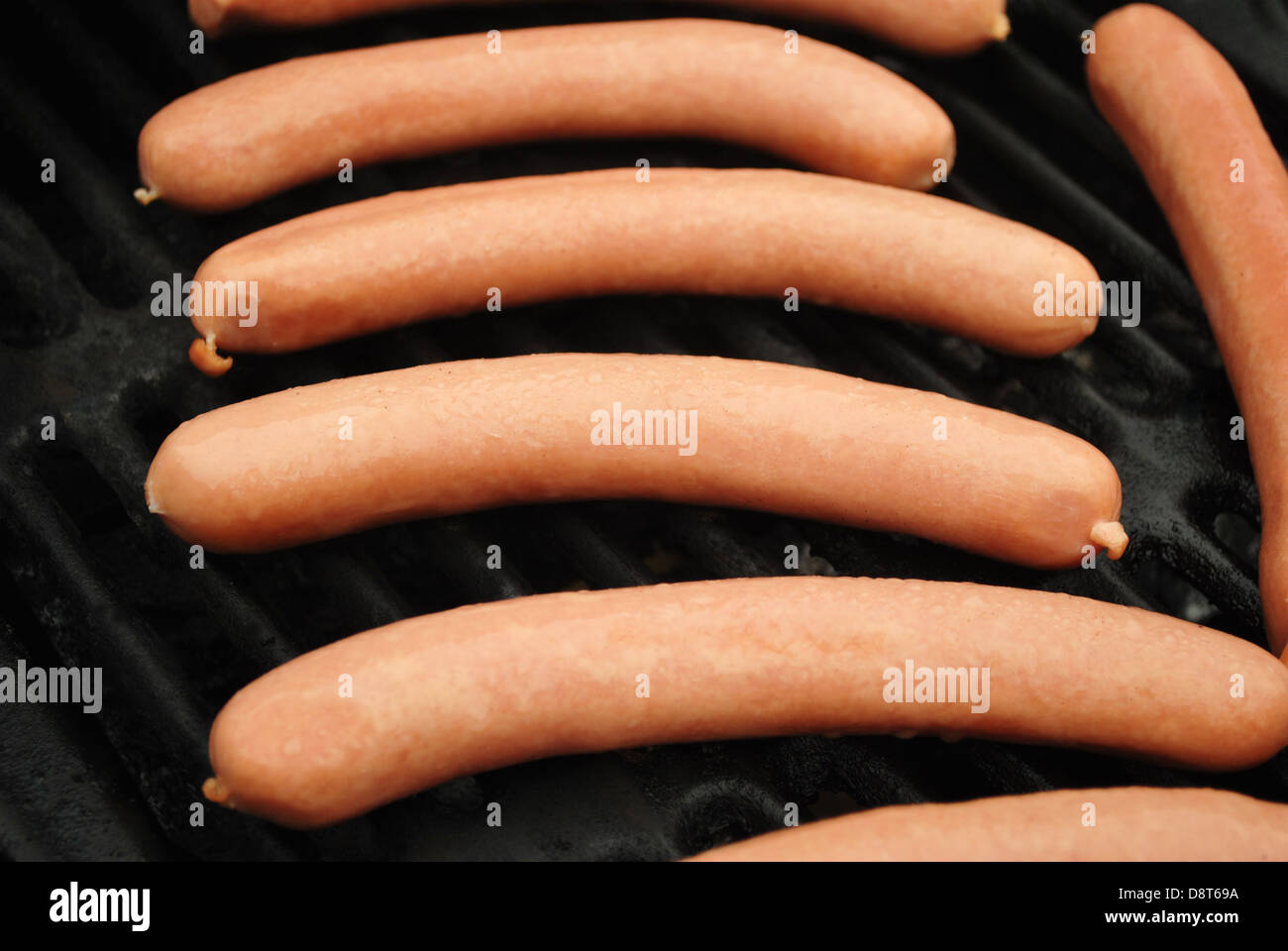 Multiple Raw Hot Dogs on a Summer Grill Stock Photo Alamy
