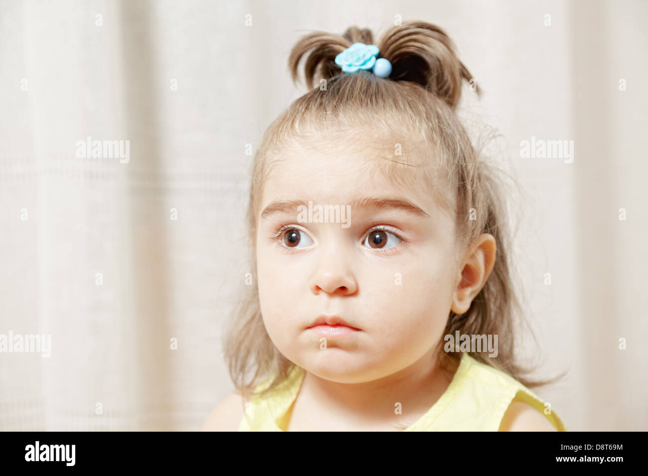 Little girl looking sideways Stock Photo