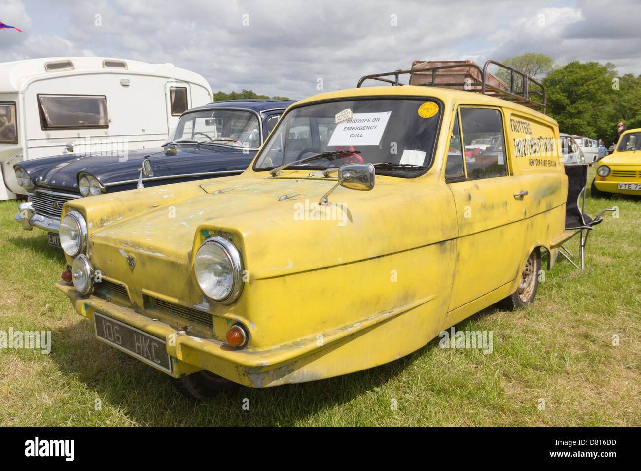 A yellow Reliant Regal Supervan in the guise of the vehicle owned by 'Del Boy' Trotter in the BBC comedy 'Only Fools and Horses' Stock Photo