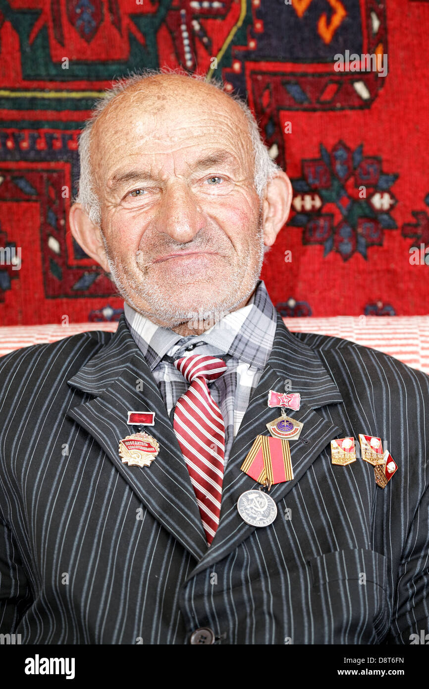 Contented senior man with medals Stock Photo
