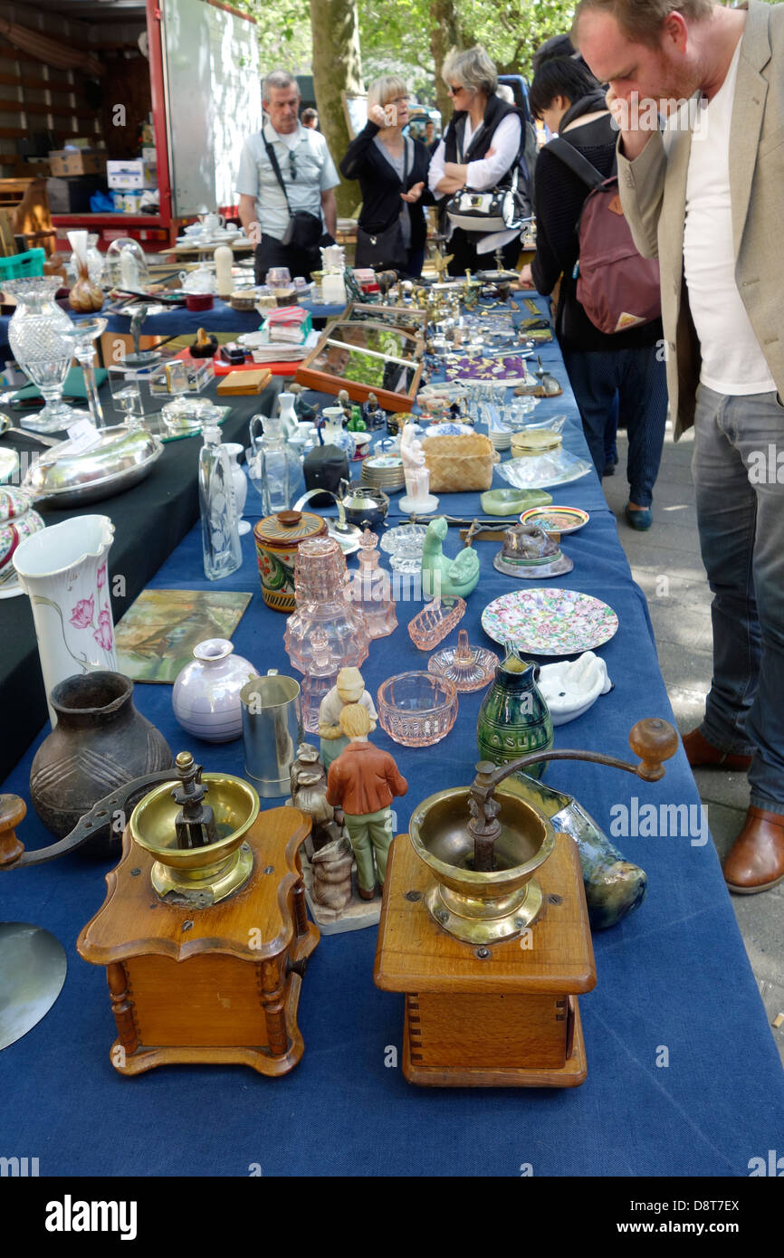 Bric-a-brac and secondhand used antiques for sale at flea market in summer in town Stock Photo