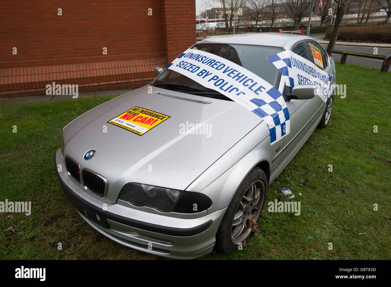 Seized uninsured BMW motor outside police station Stock Photo
