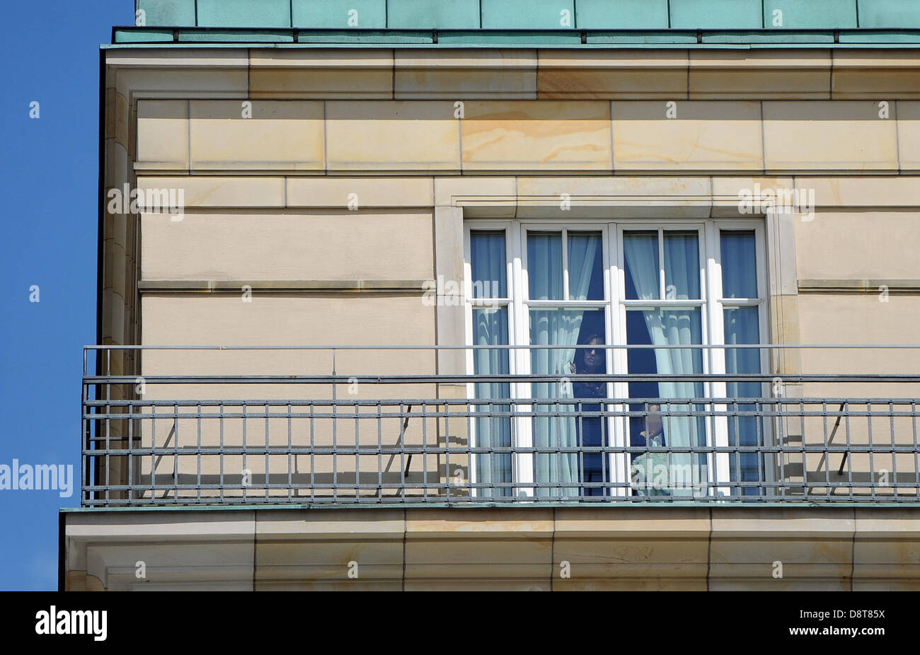 American actress Angelina Jolie and her children look out of the window in their room at Hotel Adlon in Berlin, Germany, 04 June 2013. Photo: BRITTA PEDERSEN (Attention: The children's faces have been pixeled for legal reasons.) Stock Photo