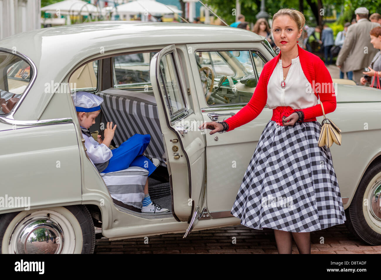 MOSCOW, RUSSIA - Retro festival 'Days of history' in Hermitage Garden. Old-fashioned woman and boy. Moscow, May 26, 2013 Stock Photo