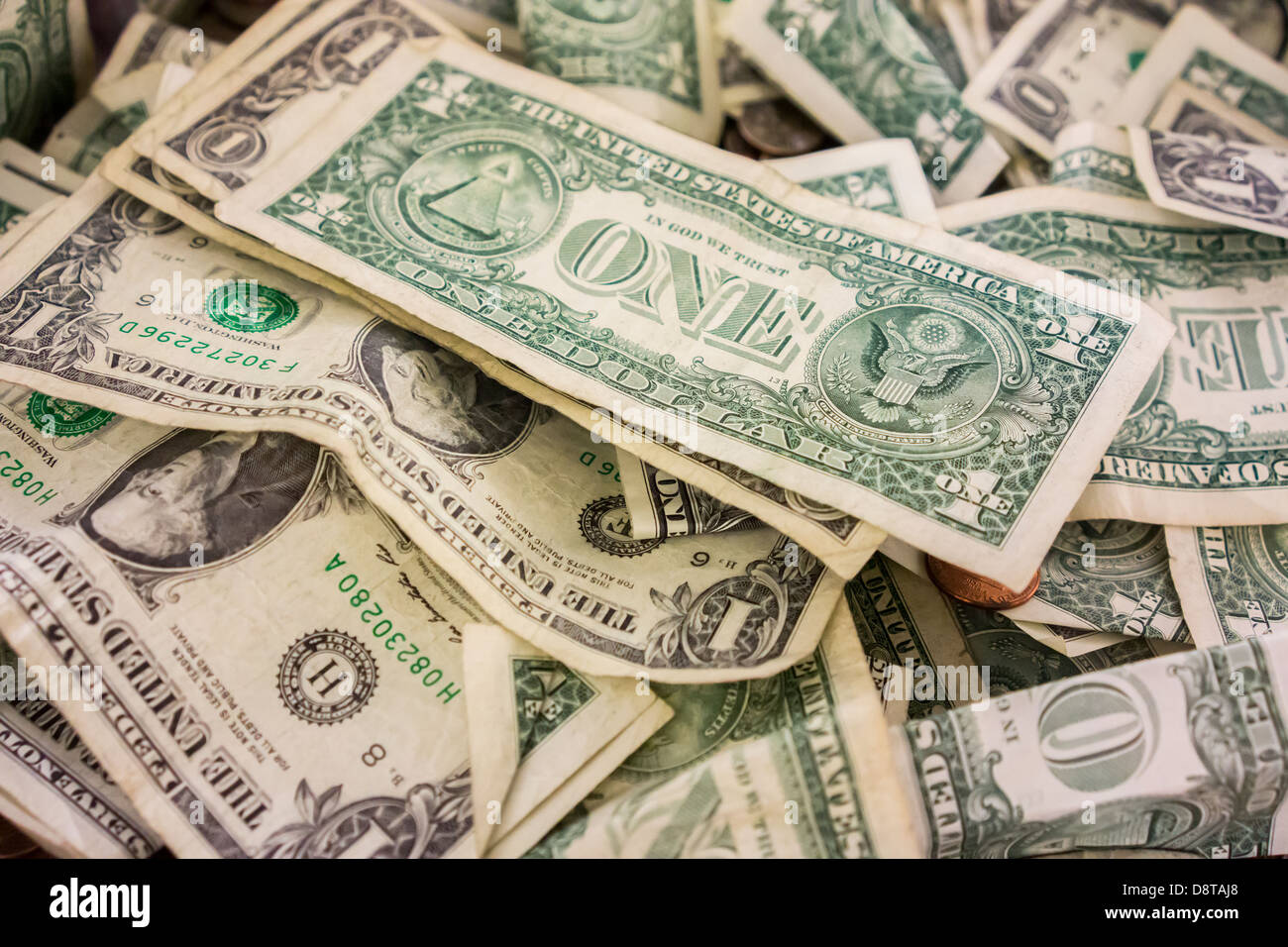 Dollar bills and change fill a donation box in a museum in New York on