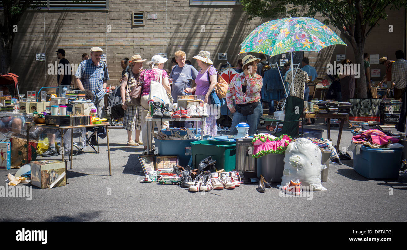 Shoppers search for bargains at a flea market in the New York