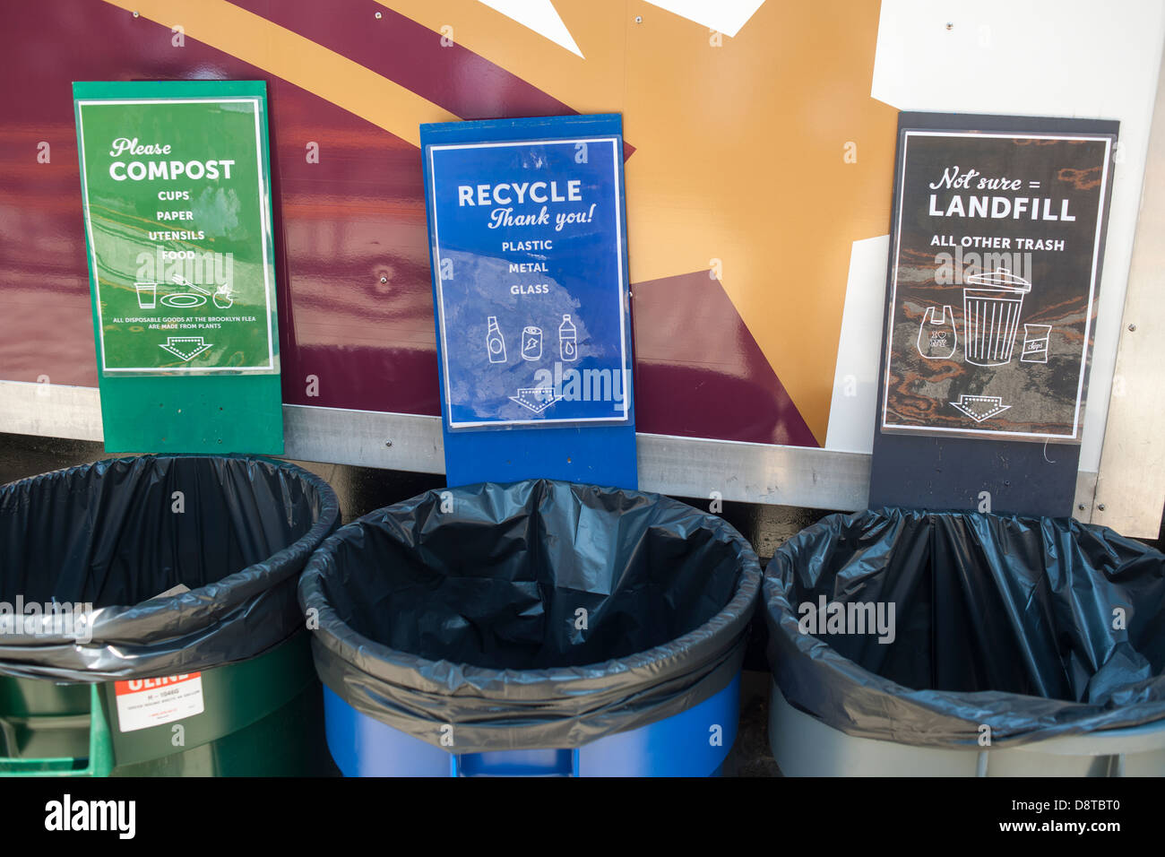 Labeled recycling bins are seen at the South Street Seaport in New York