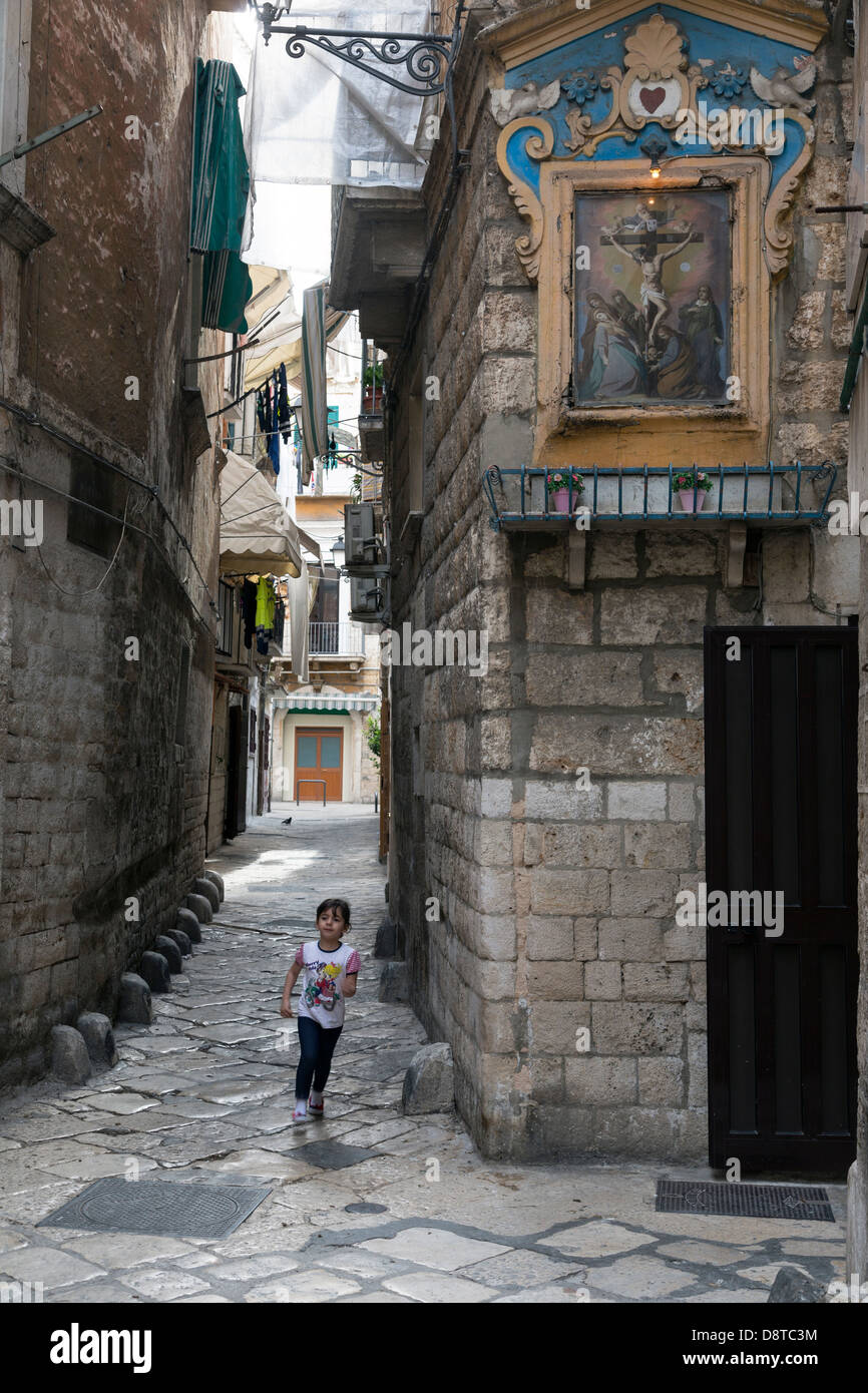 little girl running, old town, Bari, Puglia, Italy Stock Photo