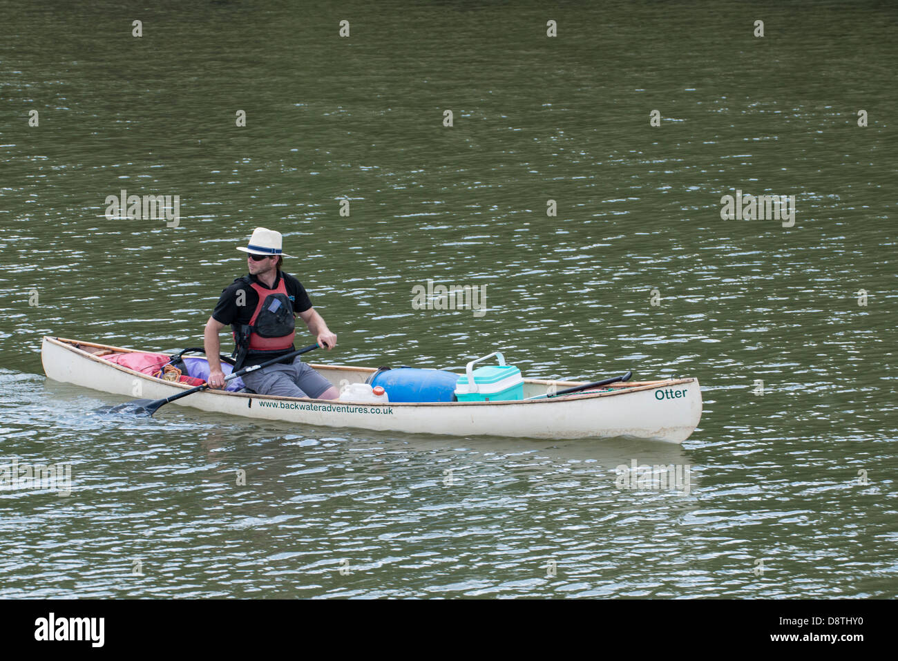 Intrepid canoeist explorers the River Dart around Stoke Gabriel in his Otter canoe Stock Photo