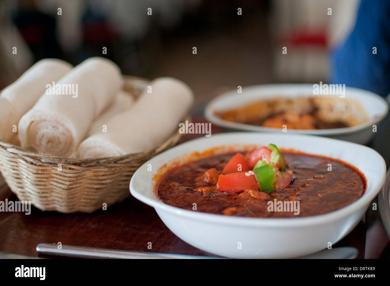 Ethiopian spiced lamb stew with Injera spongy flat bread Stock Photo Alamy
