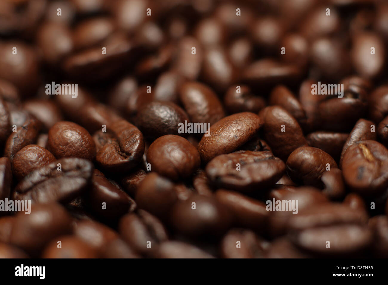 the background of coffee beans close up Stock Photo - Alamy