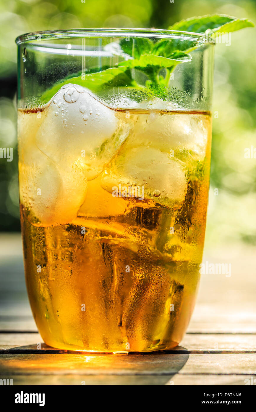 Glass of iced tea with icecubes and mint leaves, closeup Stock Photo