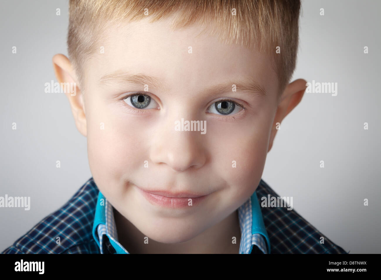 Portrait of a boy on gray background Stock Photo - Alamy
