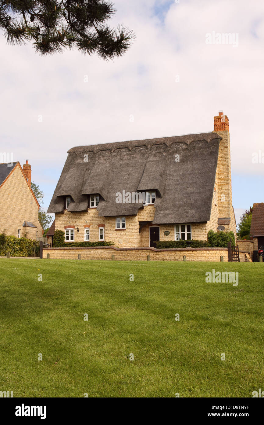 Modern thatched house home in rural Oxfordshire England UK Stock Photo