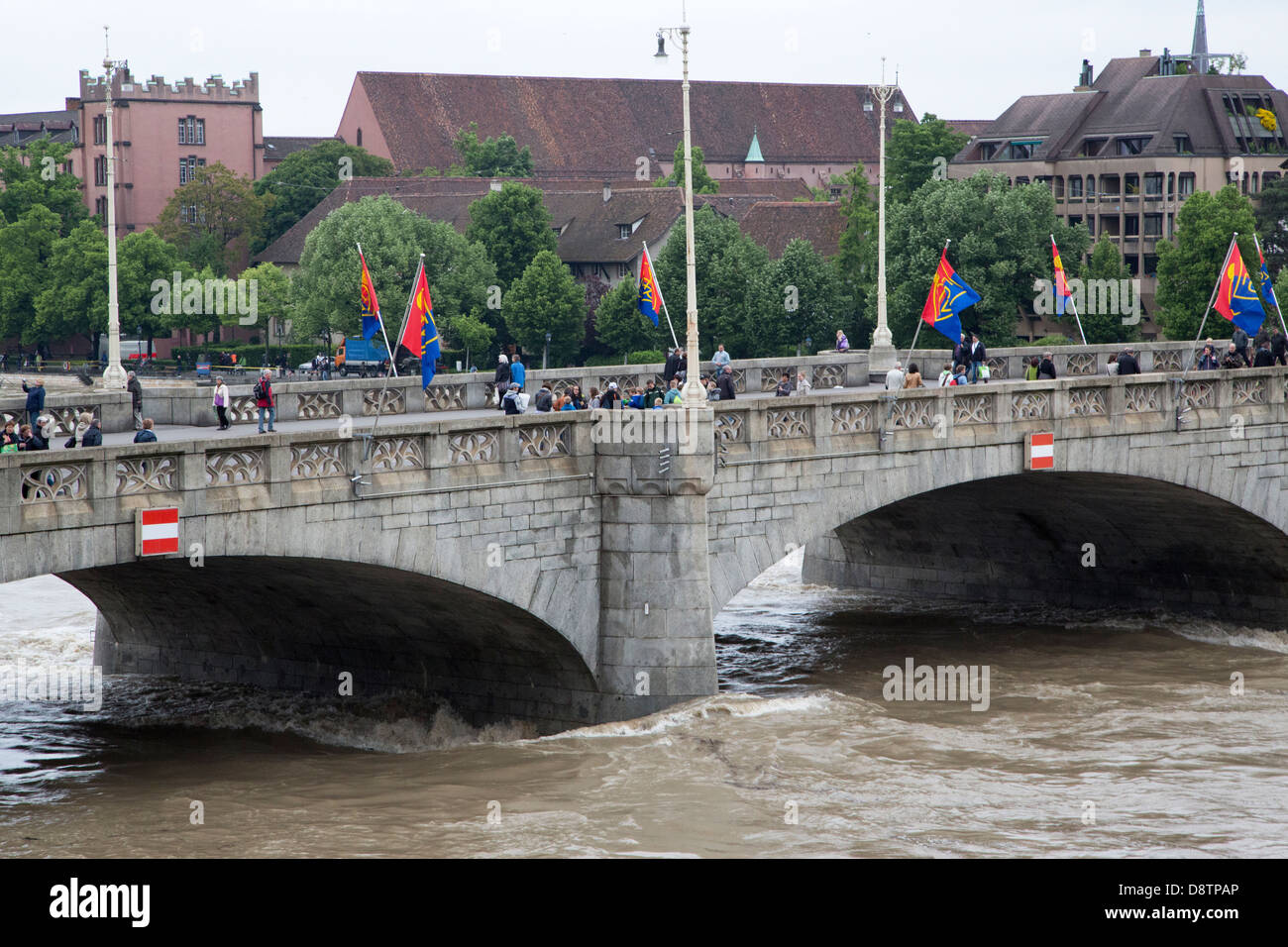 FC Basel flags on the Rhine river in Basel, Switzerland. The bridge is called the Mittlere Brücke, or Middle Bridge. Stock Photo