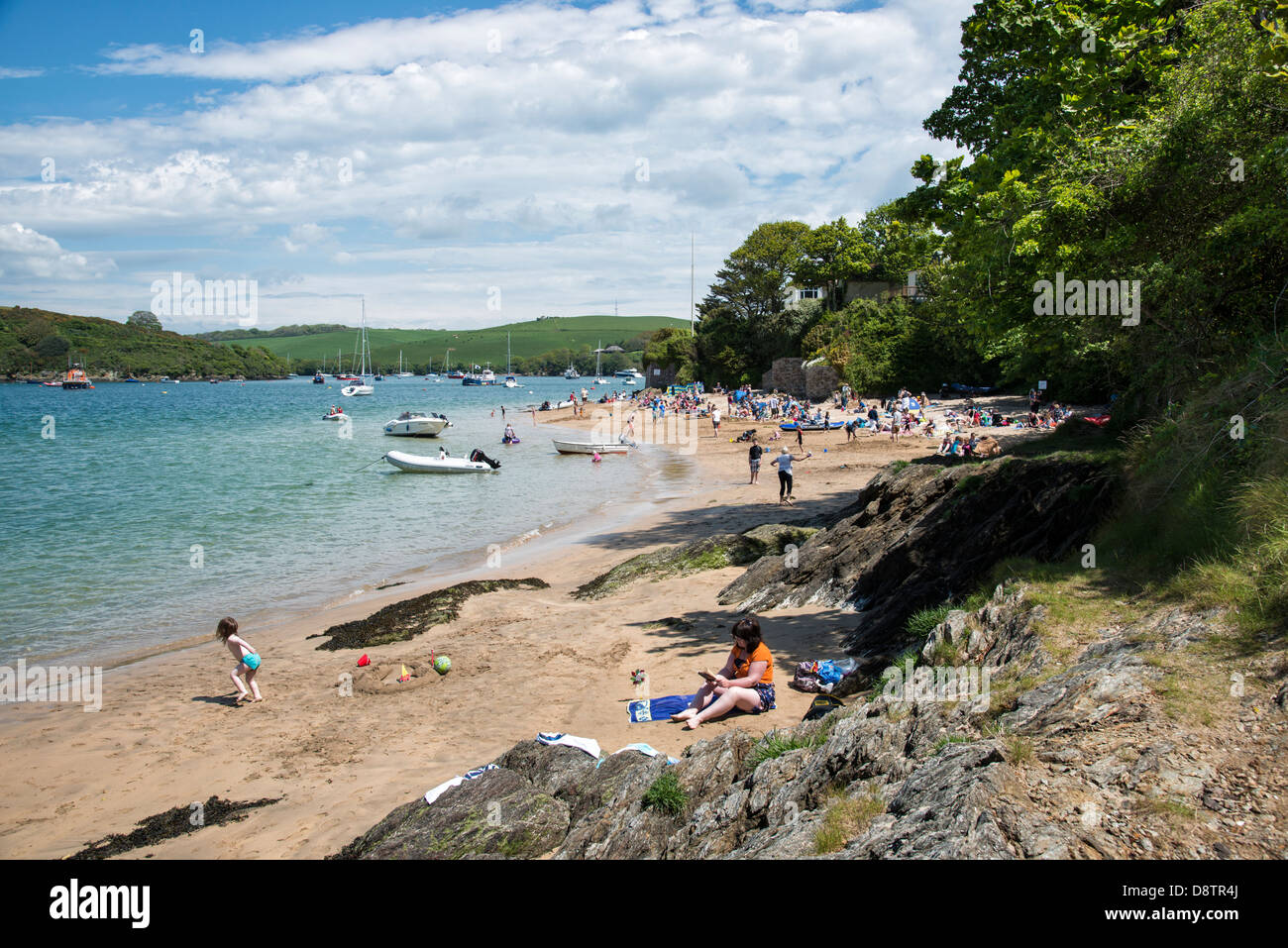 People enjoying the sandy beaches at East Portlemouth on the east side of the Kingsbridge estuary in the South Hams AONB Stock Photo