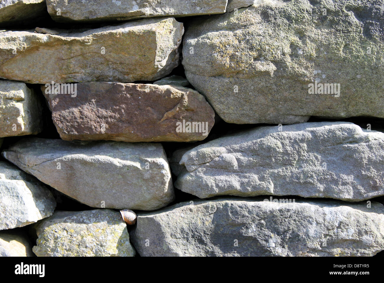 Abstract background of dry stone wall in countryside. Stock Photo