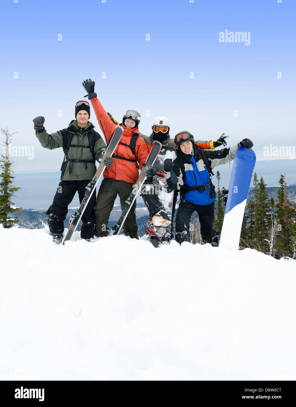 snowboarders and skiers on mountain Stock Photo