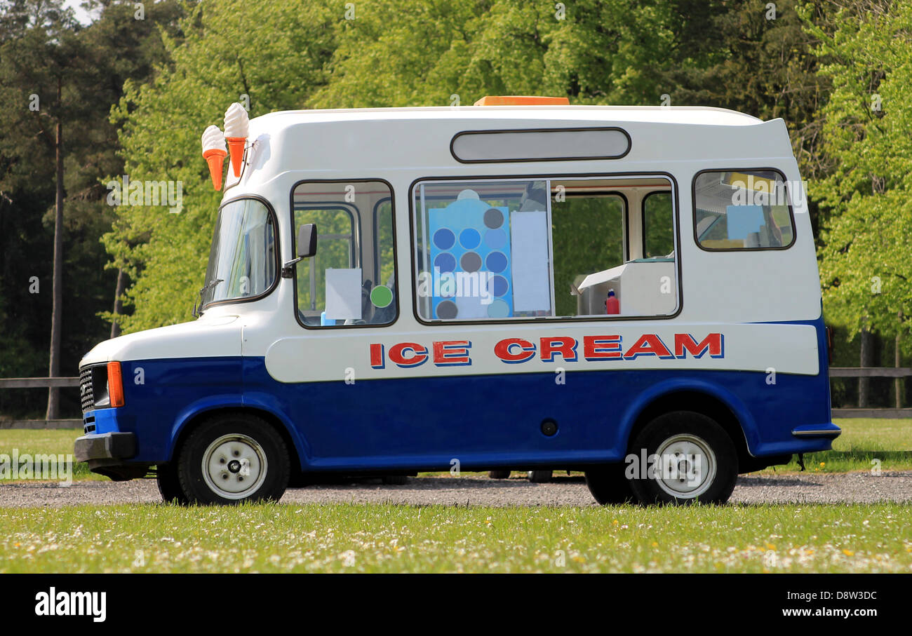 Side view of ice cream van in green countryside Stock Photo