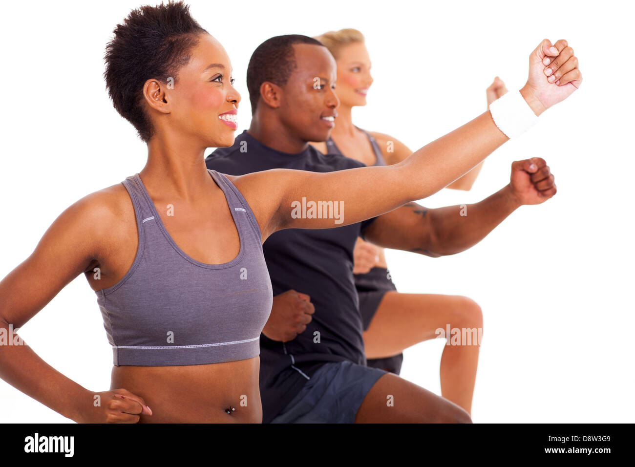 group of cheerful fit people exercising on white background Stock Photo