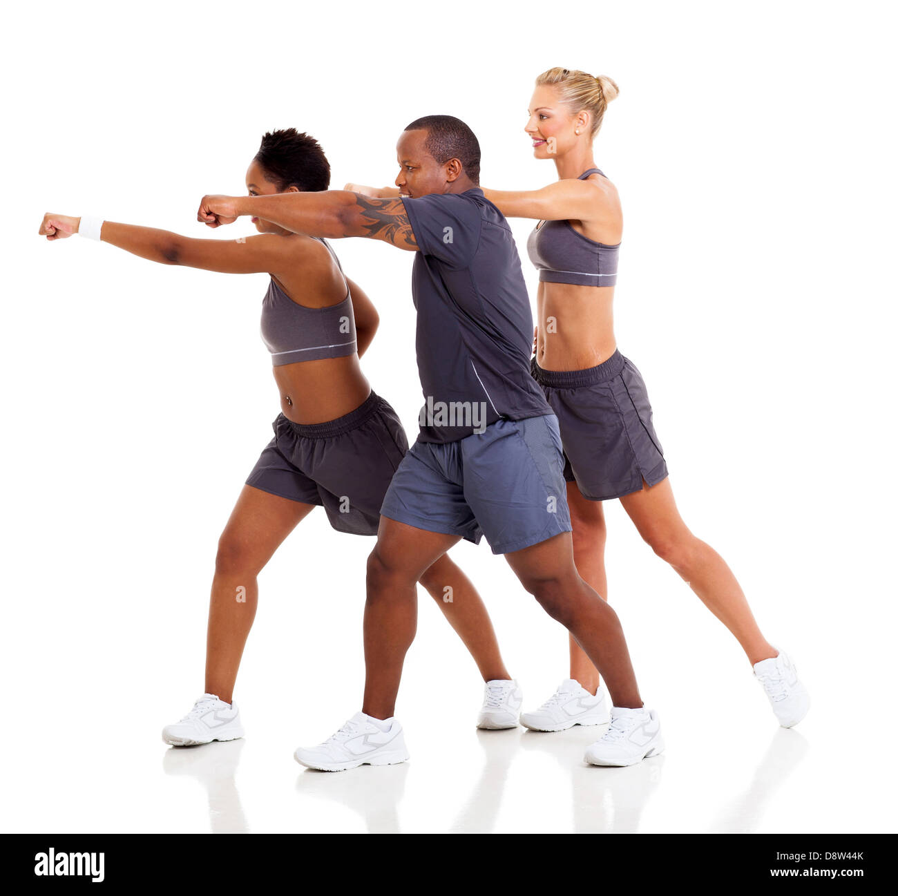 group of fit people exercising karate on white background Stock Photo