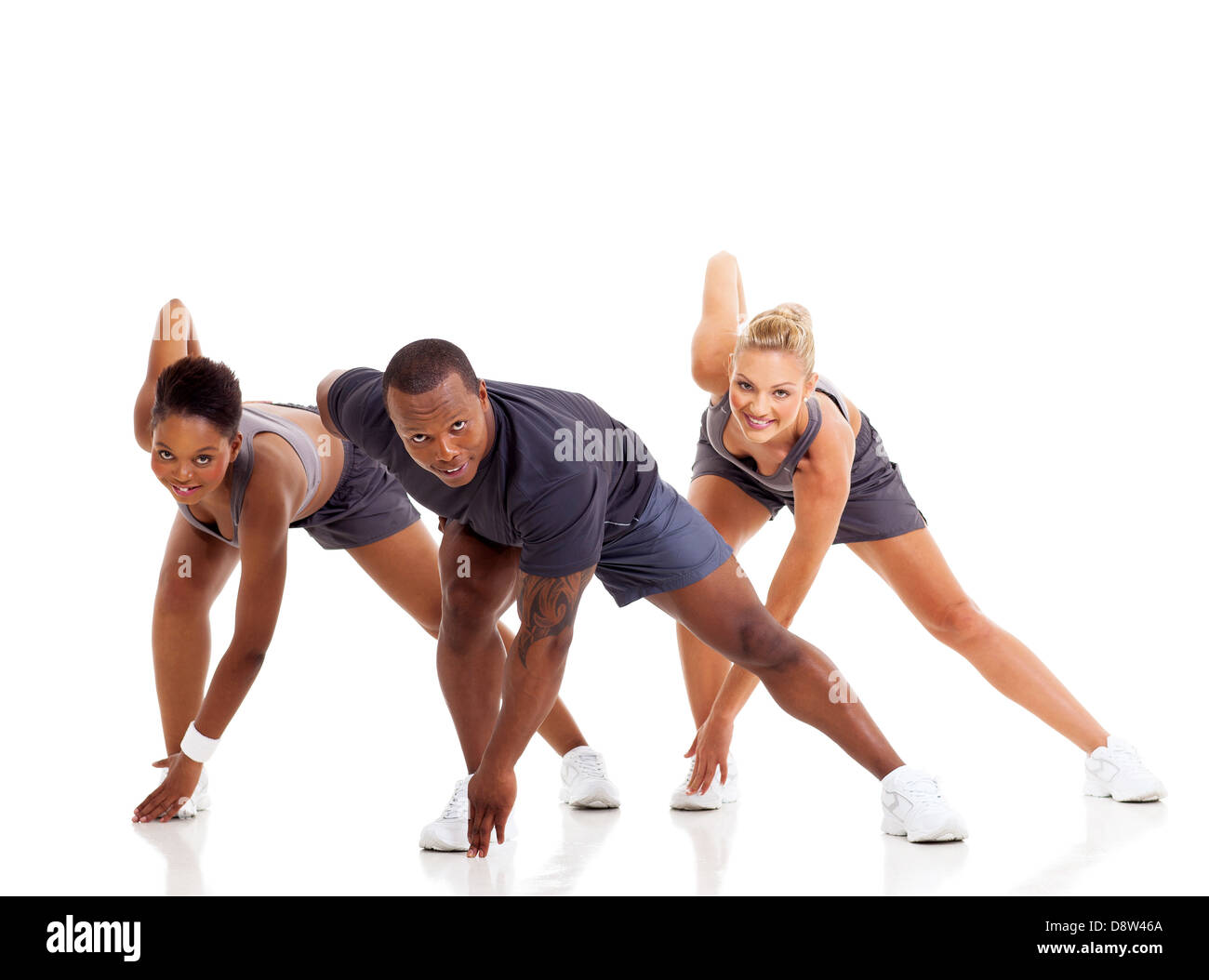 three people warming up and stretching exercise, isolated on white Stock Photo