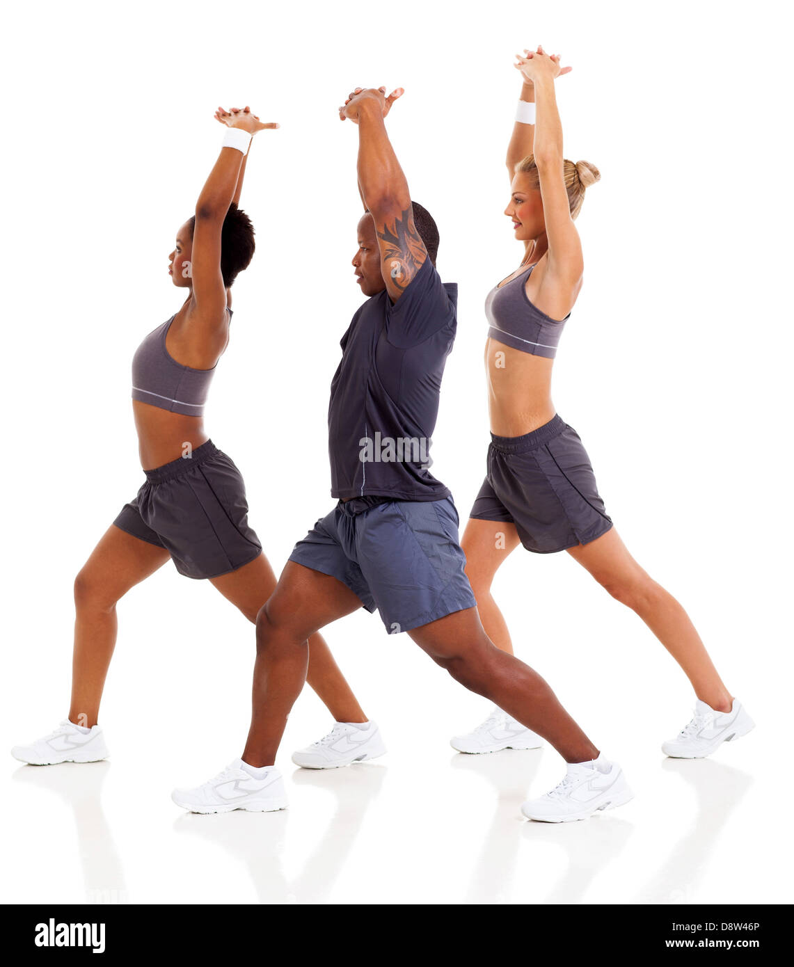 three people stretching before exercising, isolated on white Stock Photo