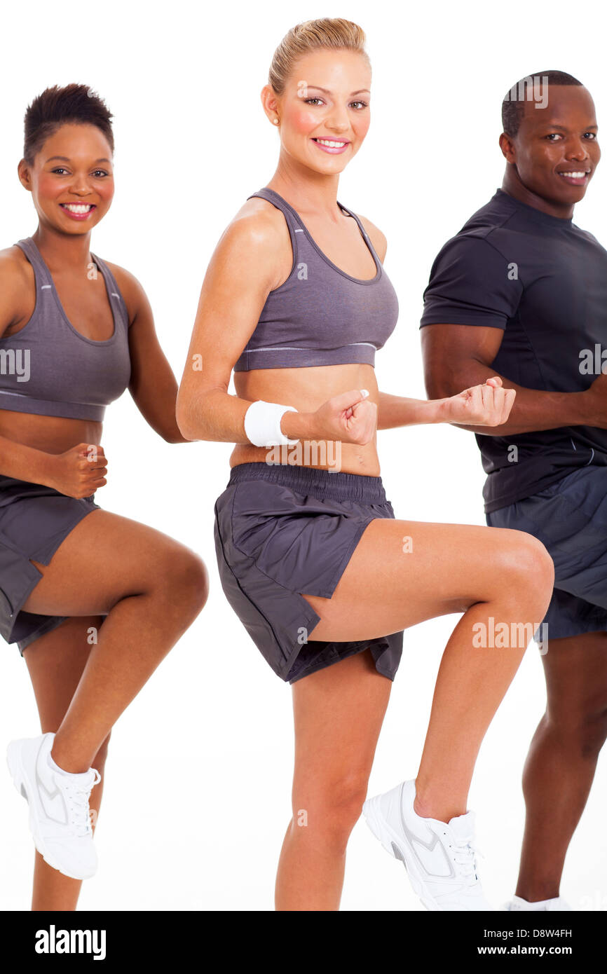 beautiful caucasian woman exercising with two friends on white background Stock Photo