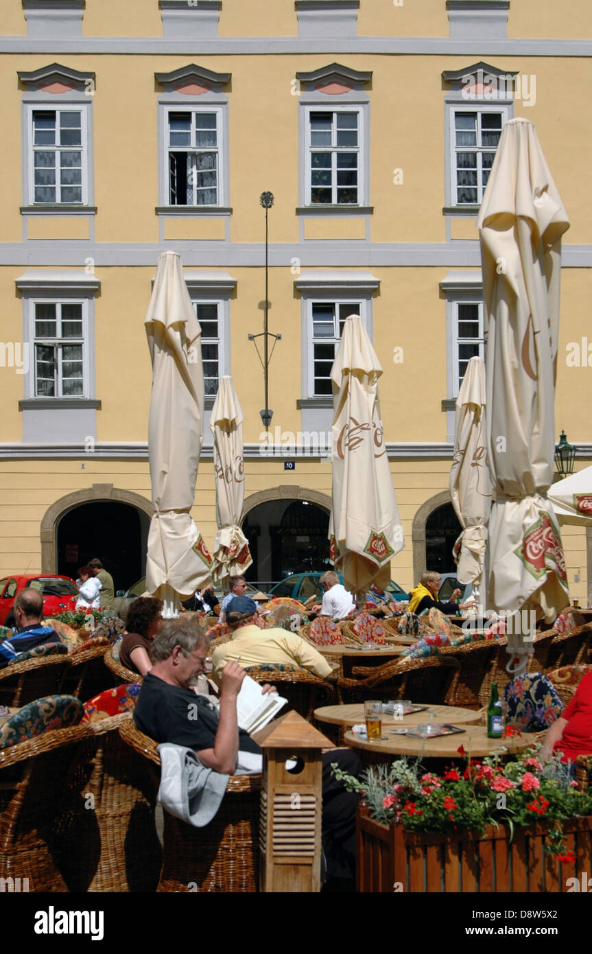 People sitting in a coffeehouse at the old Town Square Staromestske Namesti Stare Mesto Prague Czech Republic Stock Photo