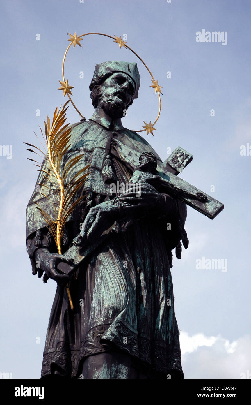 The prototypical statue of John of Nepomuk the saint of Bohemia by Jan Brokoff upon a model by Matthias Rauchmiller in 1683 located at Charles Bridge Prague Czech republic Stock Photo