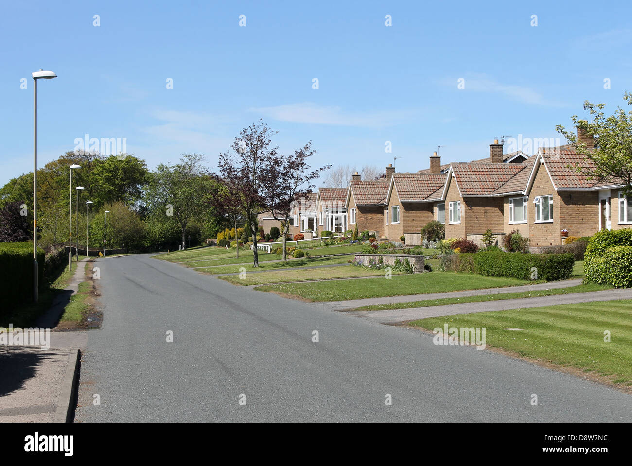 Street of bungalow houses in English Village. Stock Photo