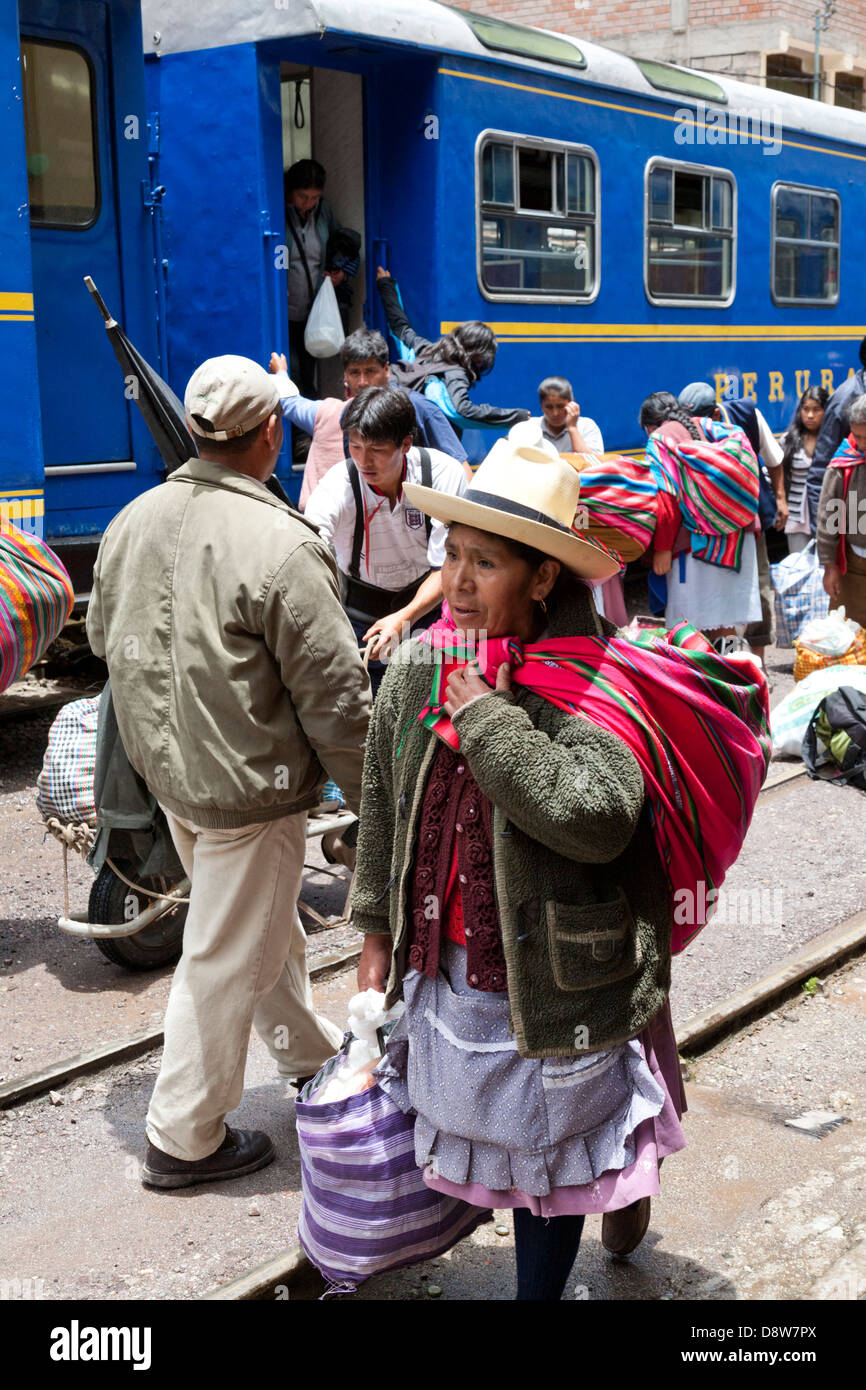 Local people deboarding the PeruRail train at Aguas Calientes Station, Machu Picchu Town, Peru Stock Photo