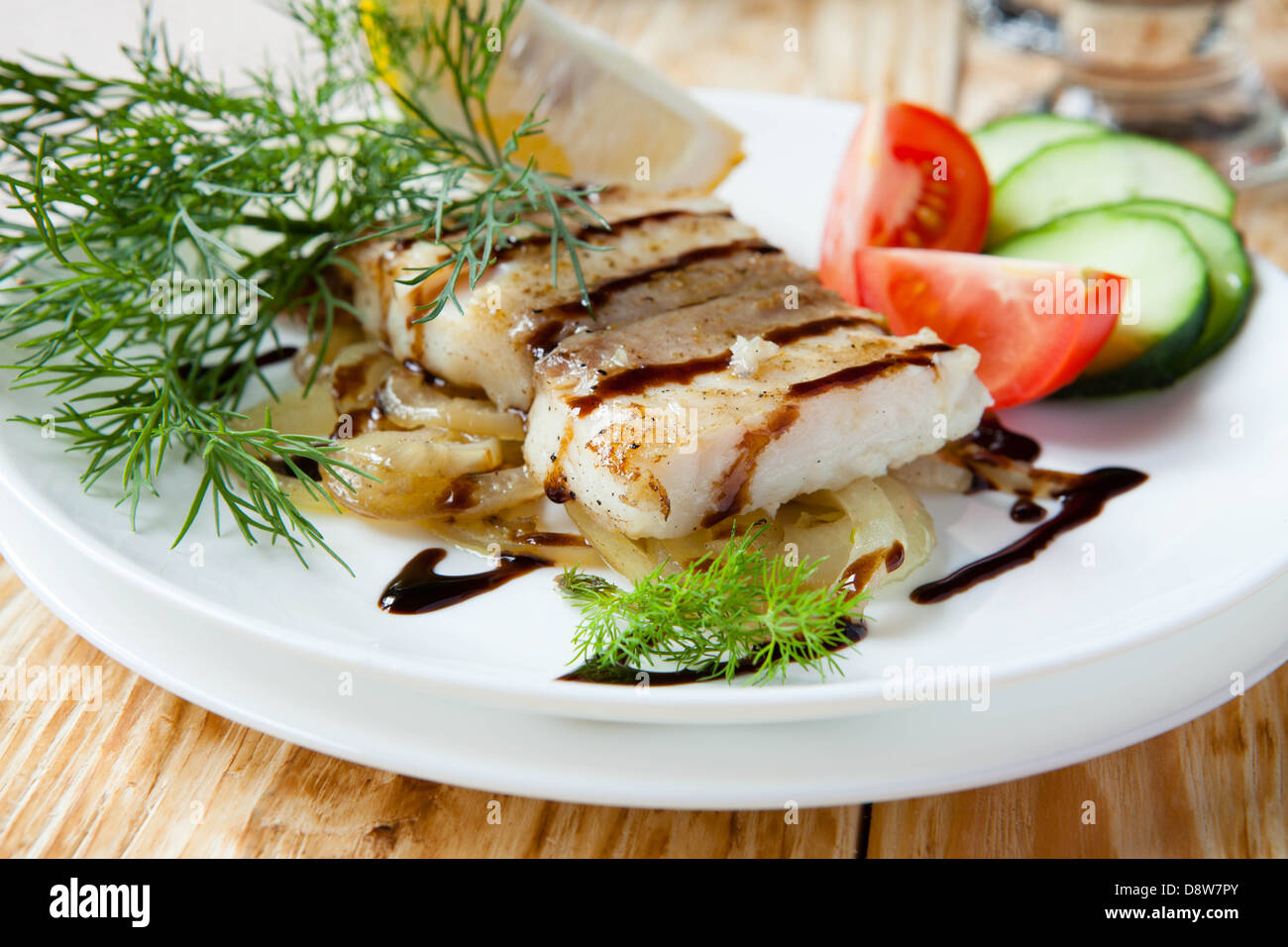 grilled fillet lemon sole with onion, food closeup Stock Photo Alamy