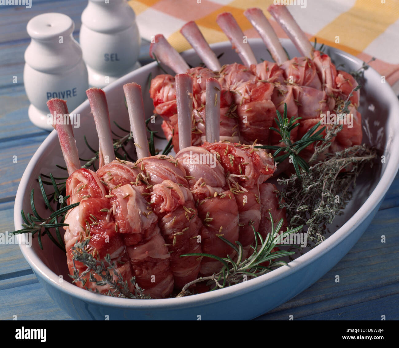 Seasoning the meat before roasting Stock Photo Alamy