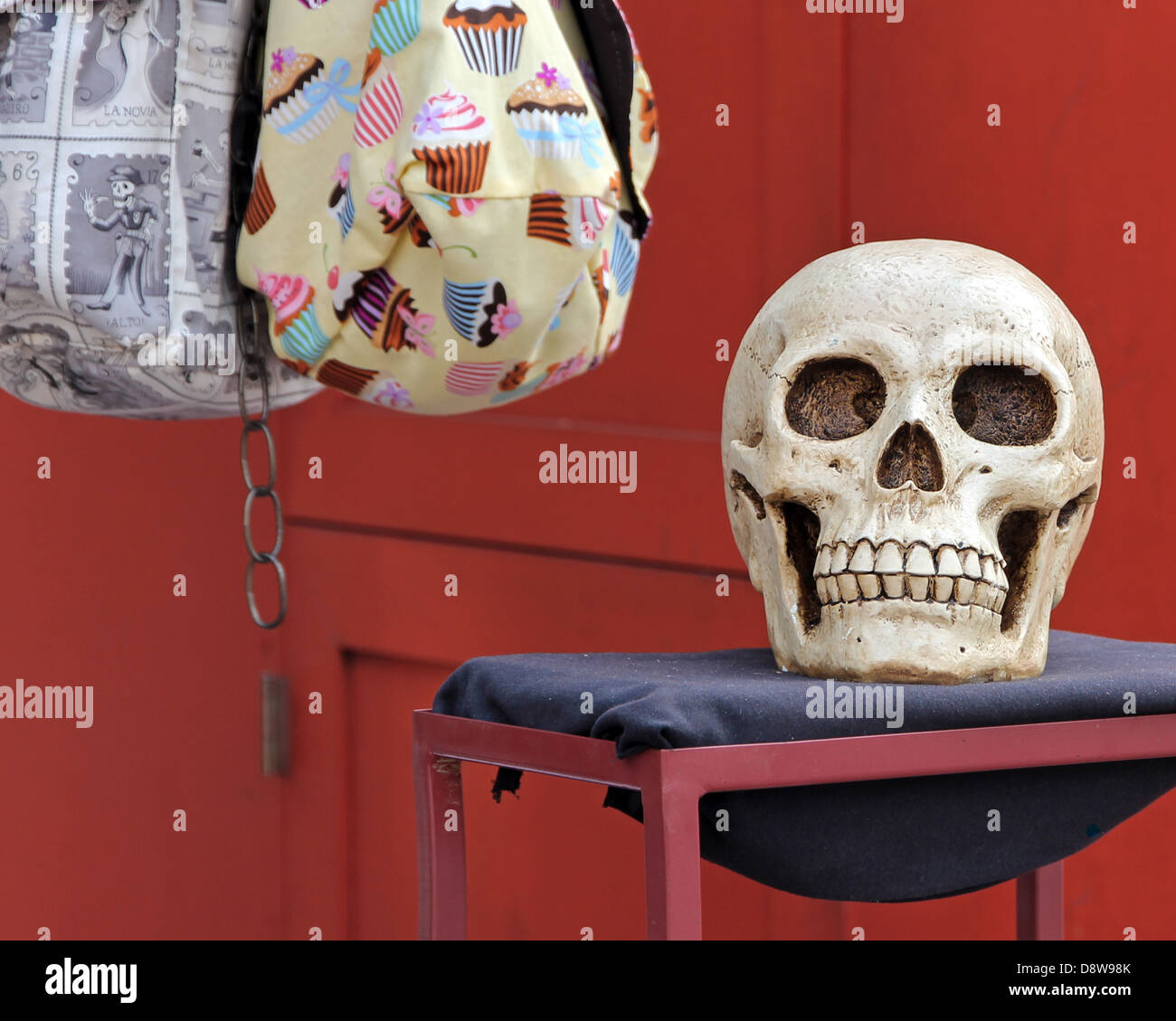 Skull and Bags for sale at a street vendor stall in Los Angeles Plaza Park near Olvera Street, Downtown Los Angeles. Stock Photo