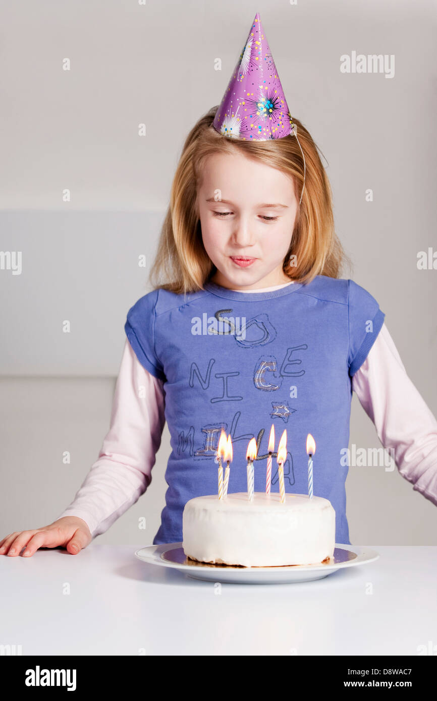 Young Girl Blowing Out The Candles Of Her Birthday Cake Stock Photo Alamy young-girl-blowing-out-the-candles-of-her-birthday-cake-stock-photo-alamy