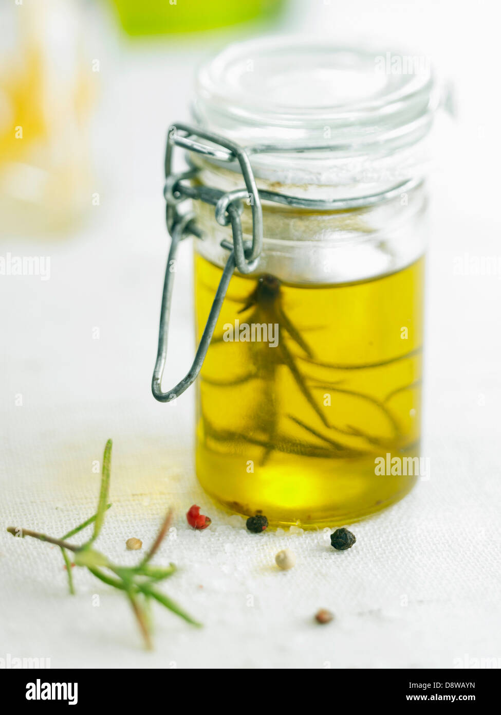 Small jar of rosemaryflavored olive oil Stock Photo Alamy