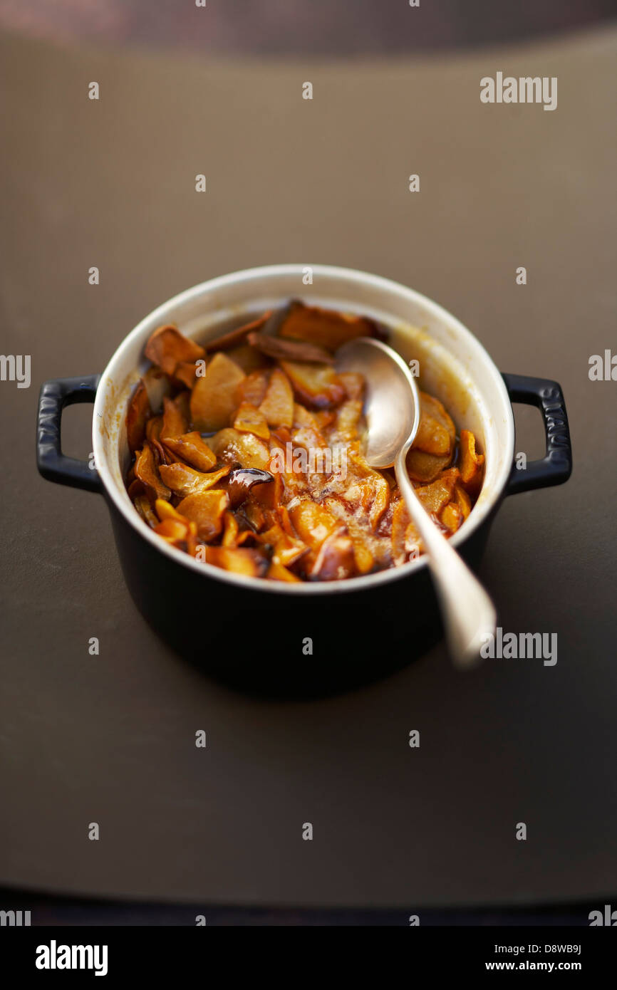 Caramelized apples in a casserole dish Stock Photo