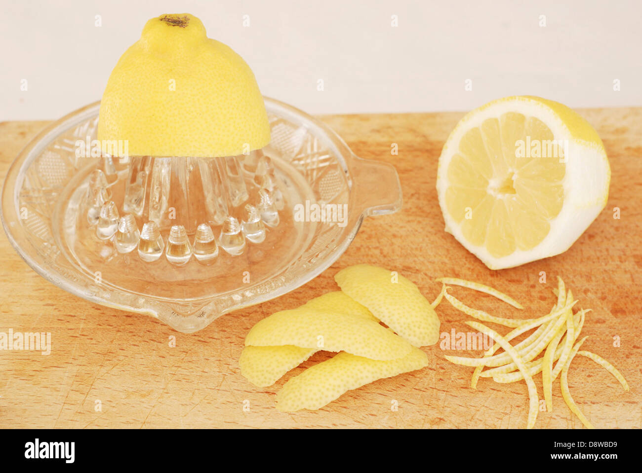 Squeezing a lemon and making zests and rinds Stock Photo