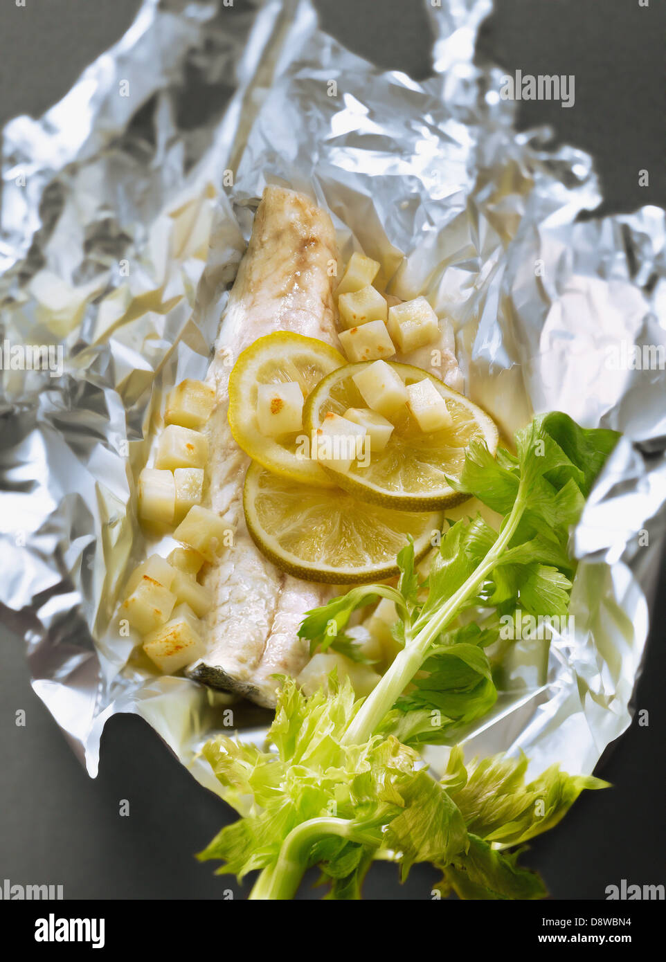 Bass fillet,lemon ,celery and celeriac root cooked in aluminium foil