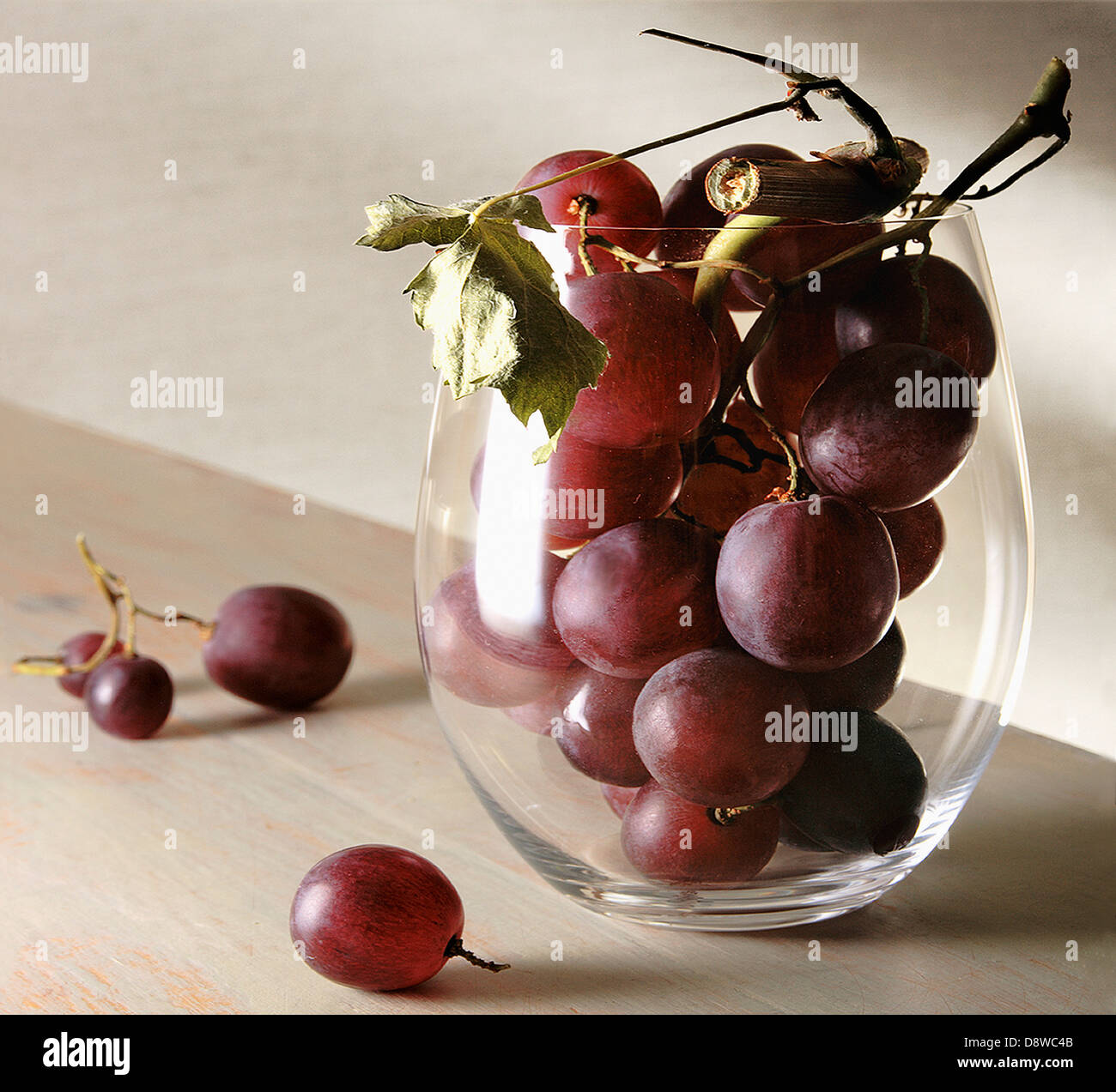 Bunch of red grapes in a glass Stock Photo Alamy