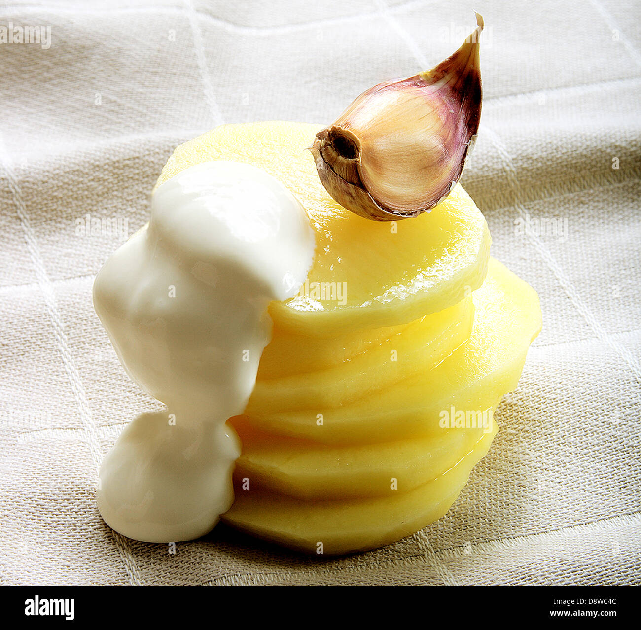 Sliced potato,garlic and cream Stock Photo Alamy