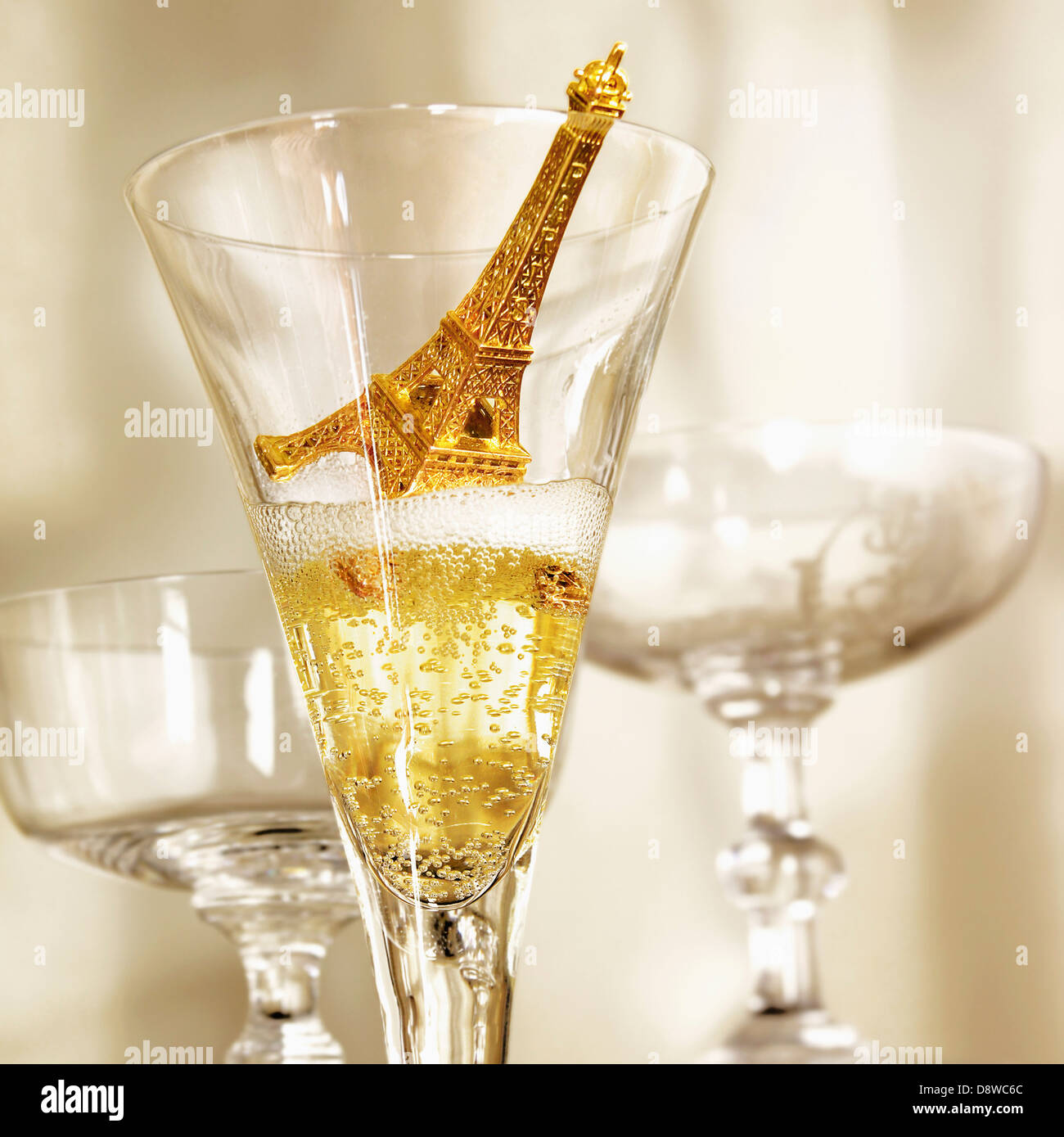 Small Eiffel tower in a glass of Champagne Stock Photo