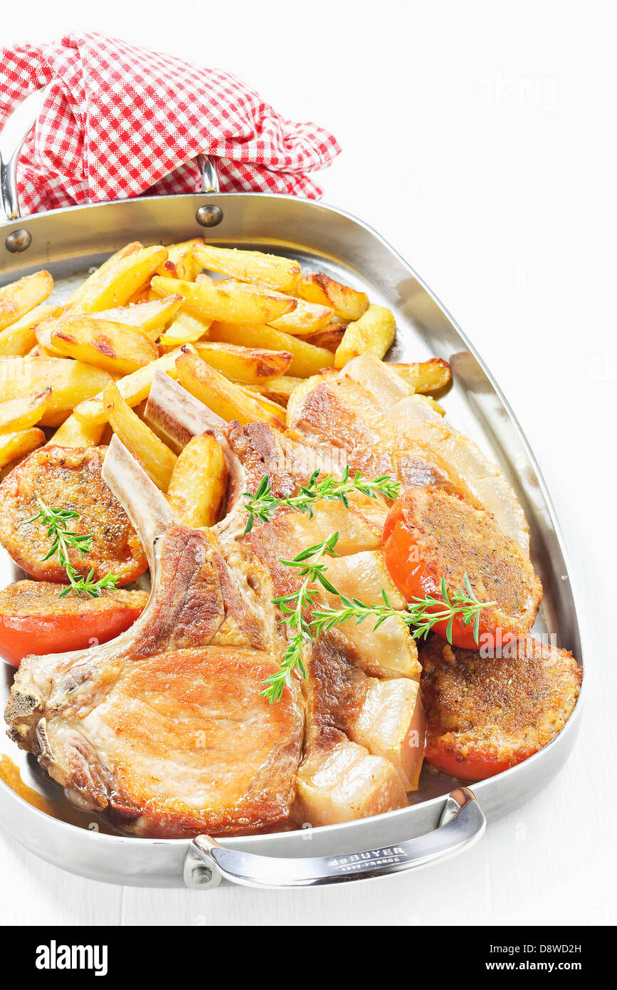 Free range pork chop Plancha with french fries Stock Photo