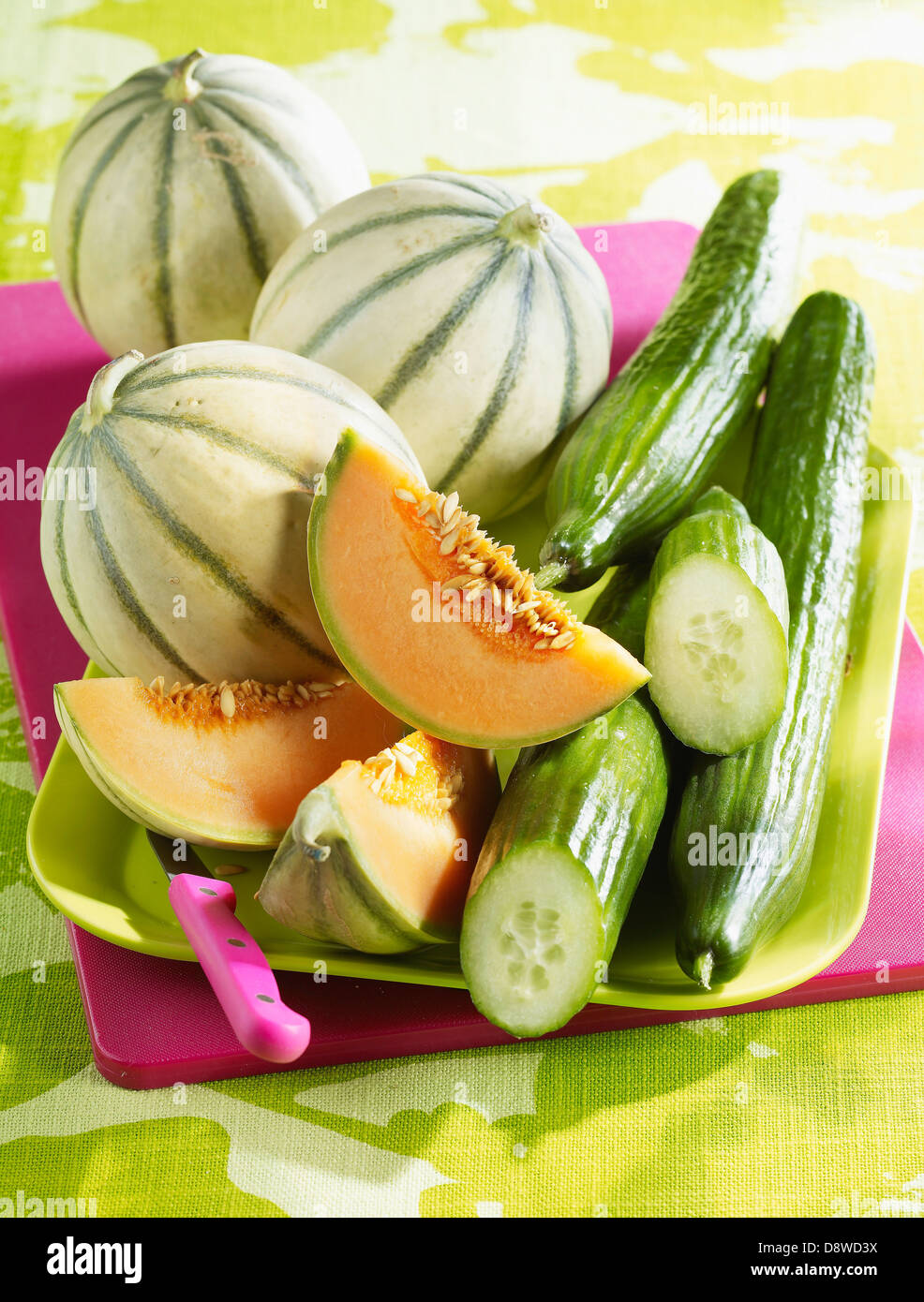 Melons and cucumbers on a tray Stock Photo Alamy