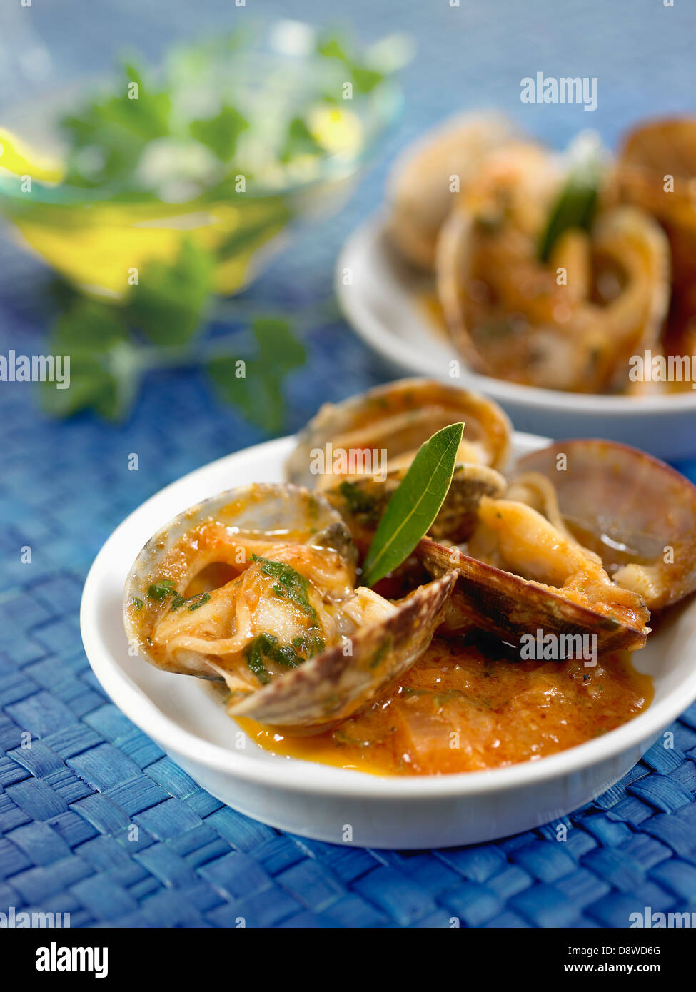 Carpet-shell clams in tomatoonion,garlic and bay leaf sauce Stock Photo