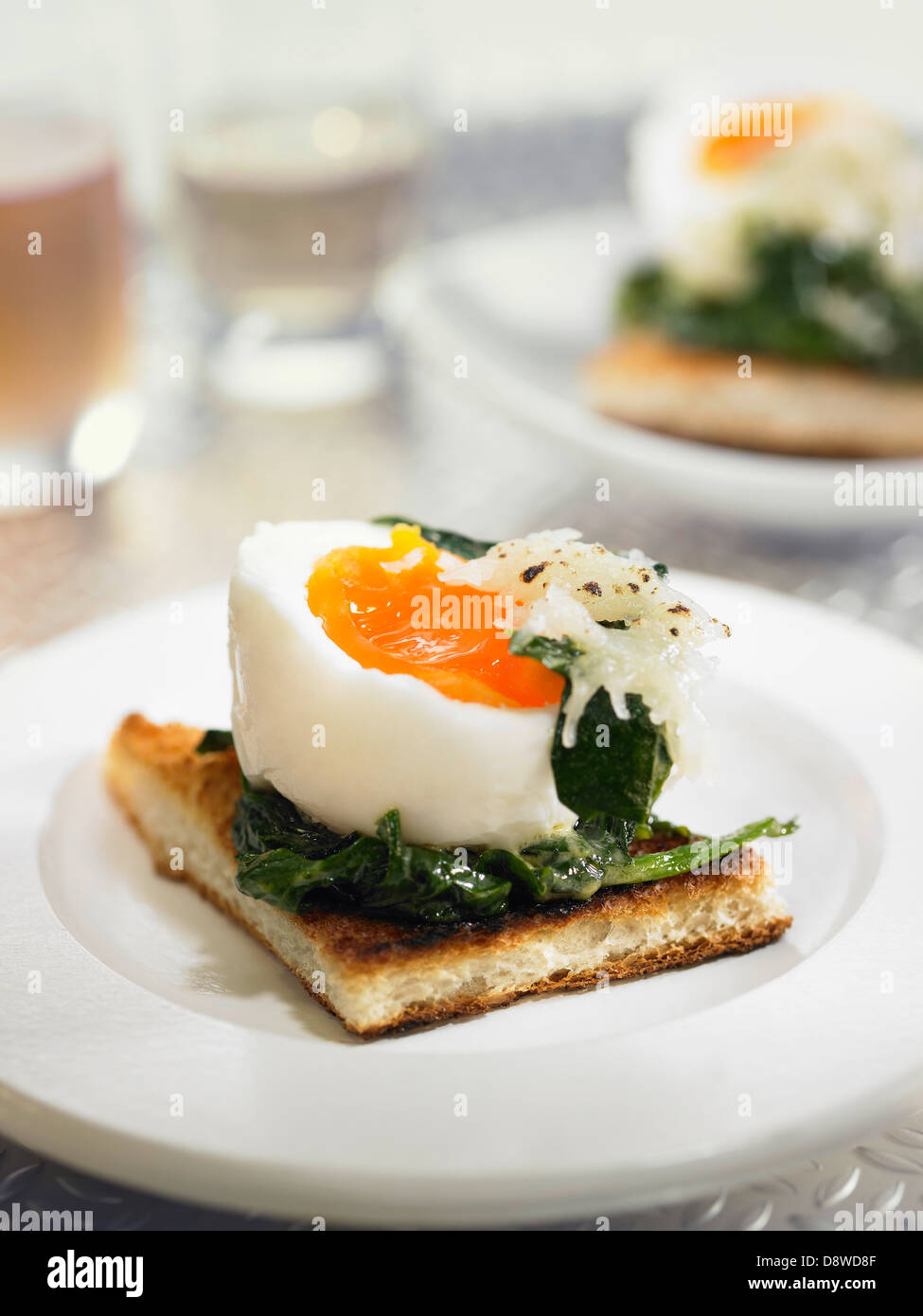 Softboiled egg,spinach and grated gruyère on toast Stock Photo Alamy