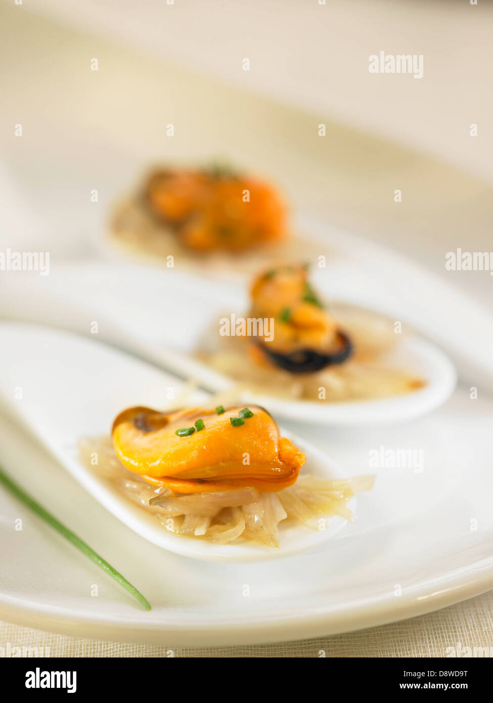 Mussels with white wine,onions and chives Stock Photo